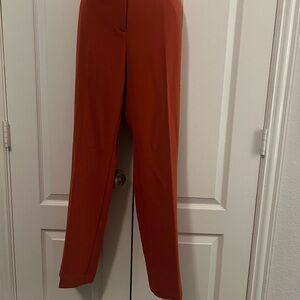 Ann Taylor brand new with tags rust colored slacks. Size 10